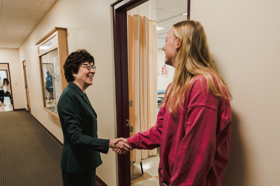Sen. Susan Collins shakes the hand of a nursing student