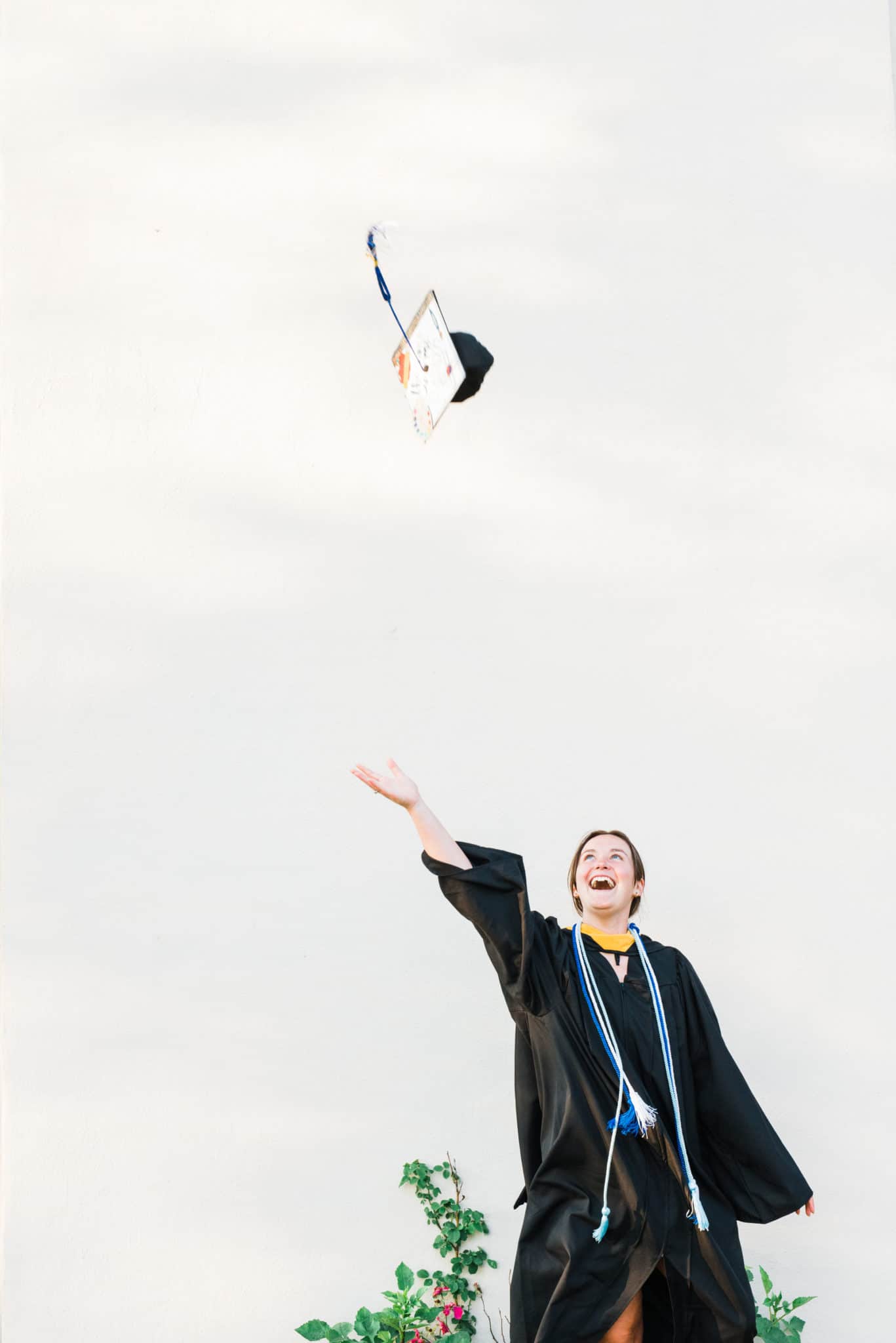 graduate throws cap