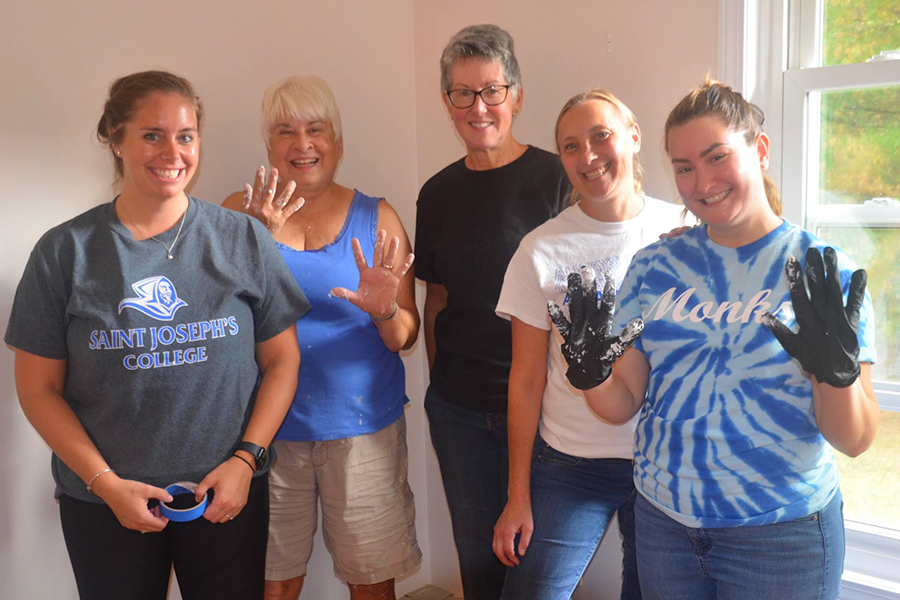 SJC volunteers Jenna Chase, Becky Thompson, Stephanie Briggs and Victoria Bernier finished the project with Caryl in the afternoon.