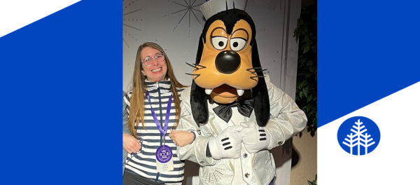 One of Disney's Top Inspiring Teachers, Lisa White Farese 99 elementary education, meets Pluto.