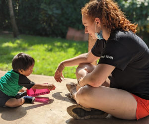 Maeghan Perkins in Guatemala playing with a toddler