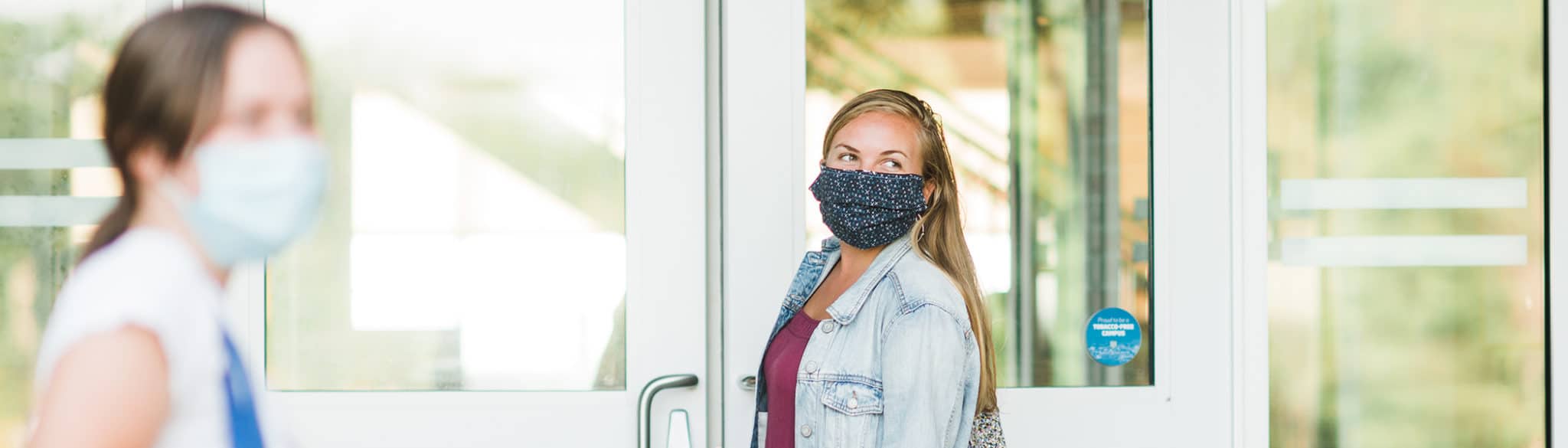 female students wearing masks outside