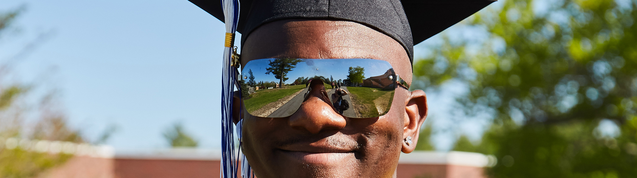 graduate with sunglasses on